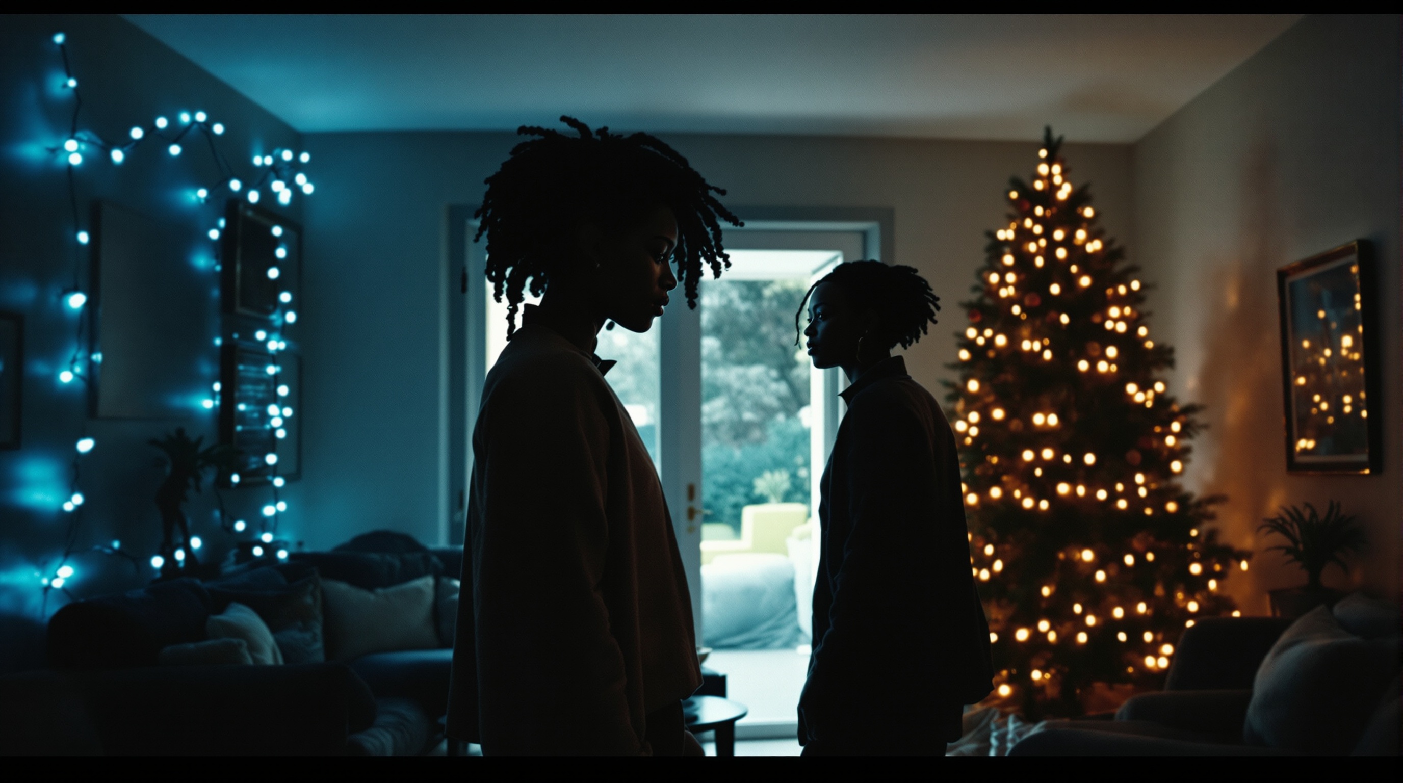 Two silhouetted figures in a living room, cold blue string lights on one wall and a warm tungsten Christmas tree on the other.